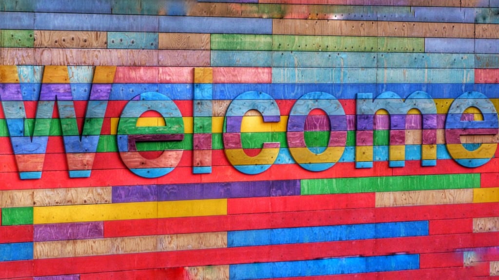 a colourful sign that says welcome