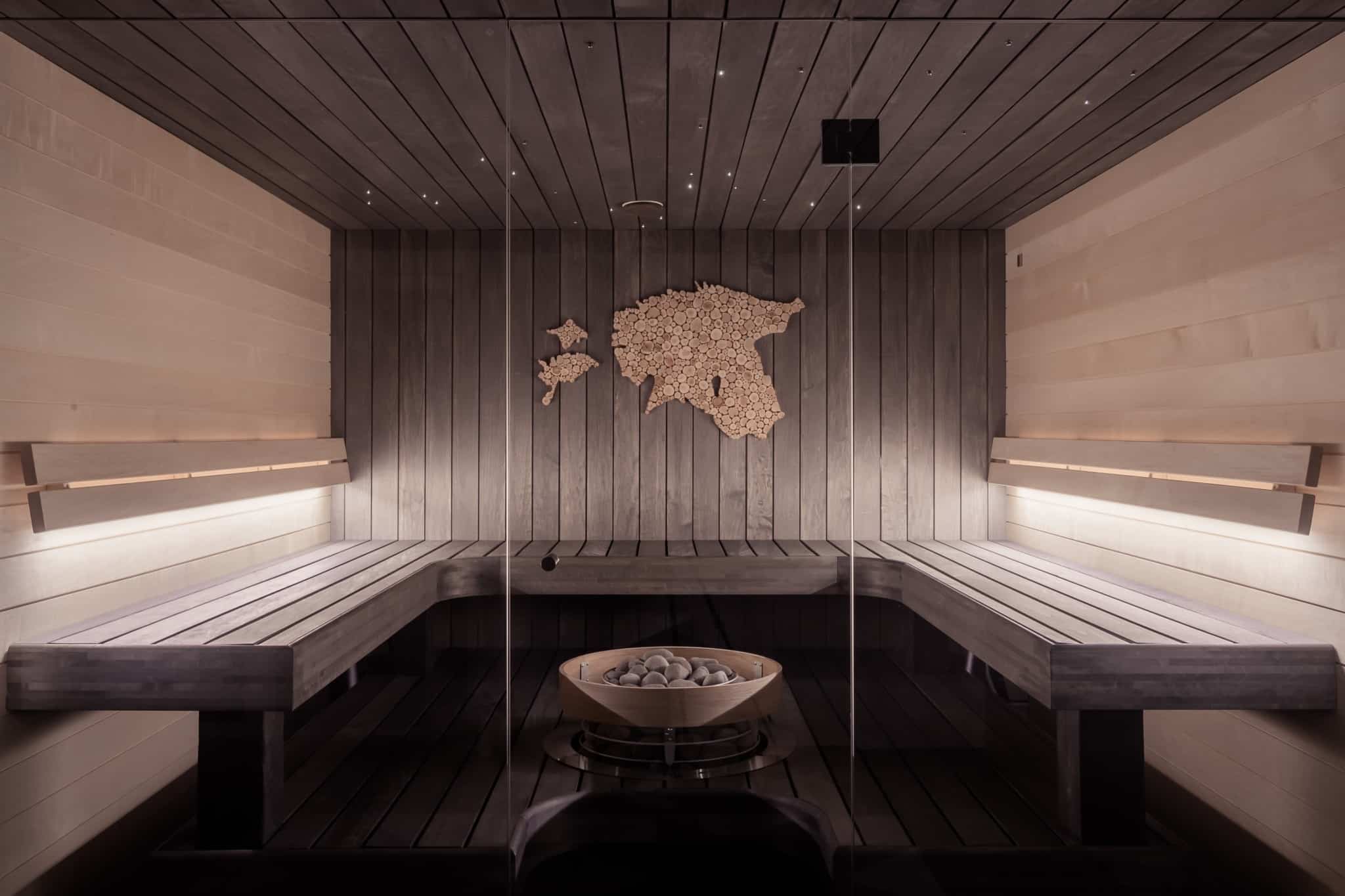 Wooden Sauna Inside of a wooden sauna with a world map on the wall