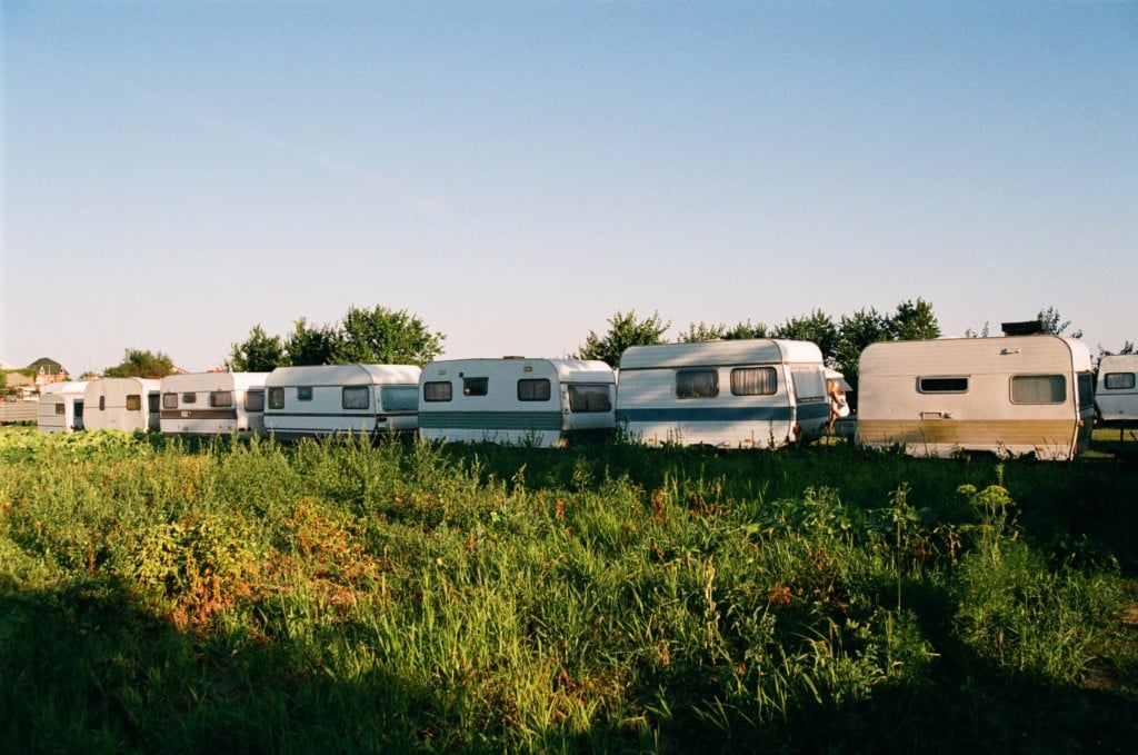 row of caravans in field