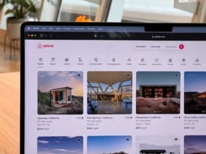 laptop displaying Airbnb home page