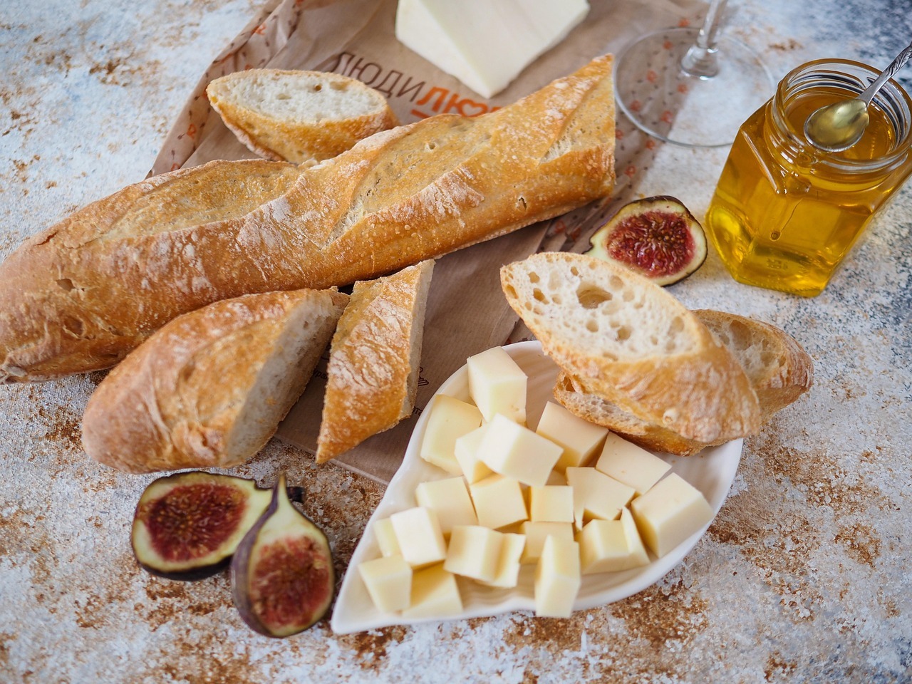 Alt text: a selection of local artisan products like bread, cheese or honey.
